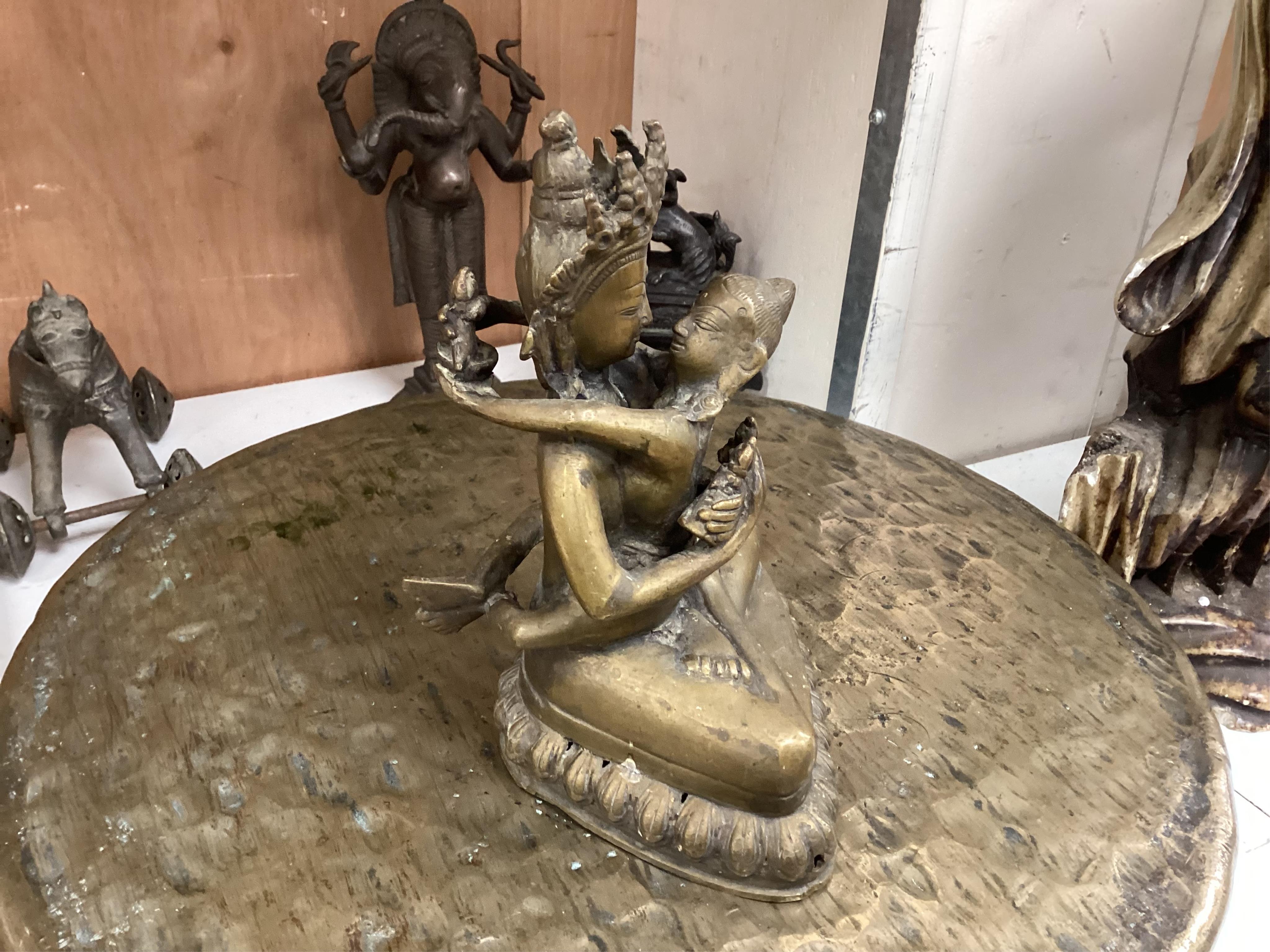 A group of four south east Asian cast bronzes and a gong with mount and beater, 40.5cm